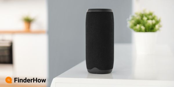 A sleek, black smart speaker on a living room side table Smart Home Upgrades